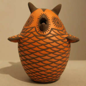 Orange and black owl effigy