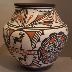 Medallion, deer heart line and geometric design on a polychrome jar