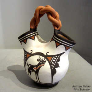 Deer-in-his-house motif on a polychrme wedding vase with a braided handle
