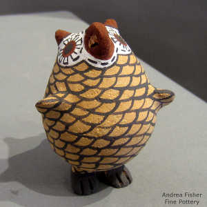 Feet on a polychrome owl figure