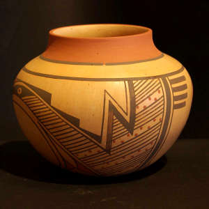 Stylized bird element and geometric design on a polychrome jar