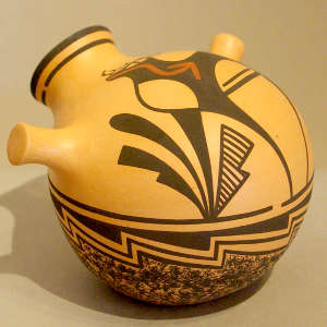 Deer, heart line and geometric design on a polychrome canteen