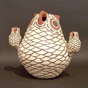 2 chicks on a Zuni storyteller owl